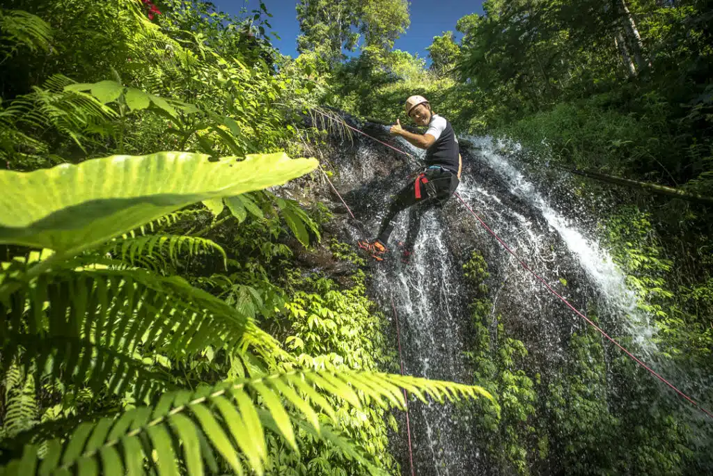 Canyoning descent North Bali waterfall rappel